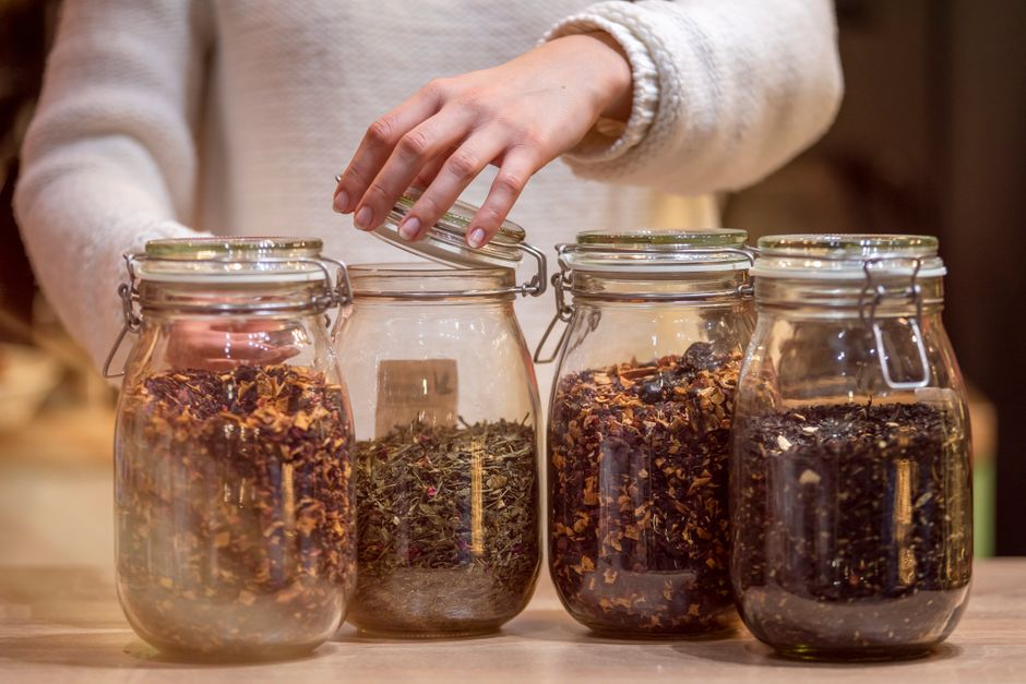 assorted tea leaves in vintage glass jars